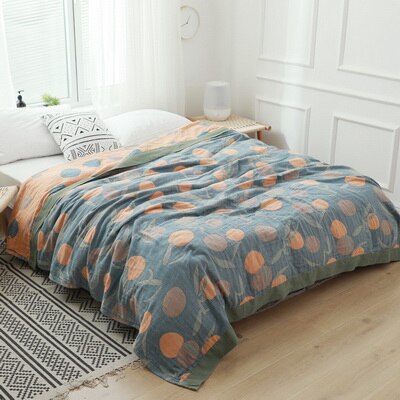 navy and orange reversible bedthrow with fruit print